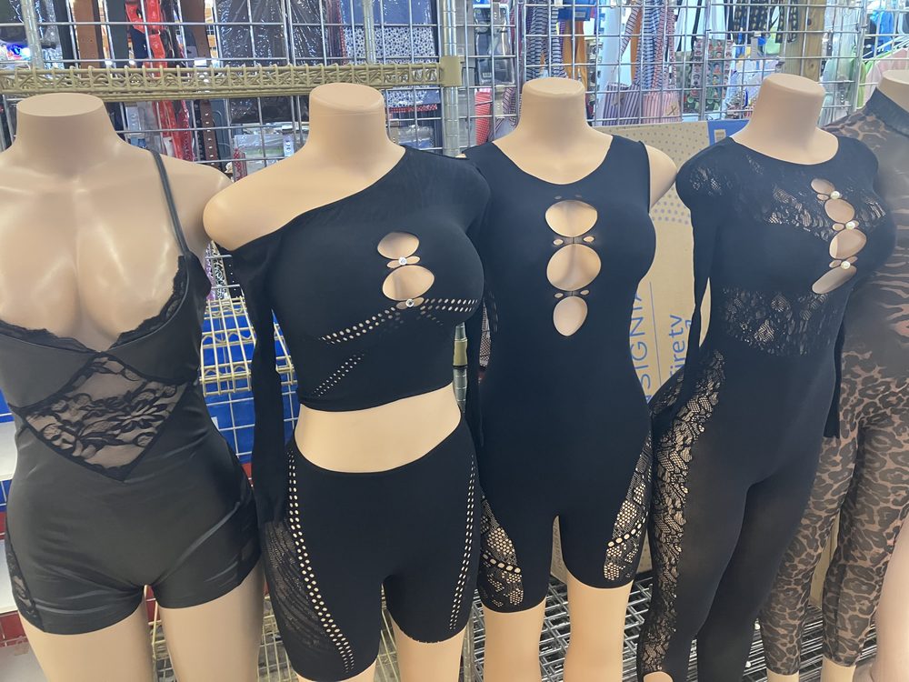 Black cutout bodysuits and catsuits on mannequins