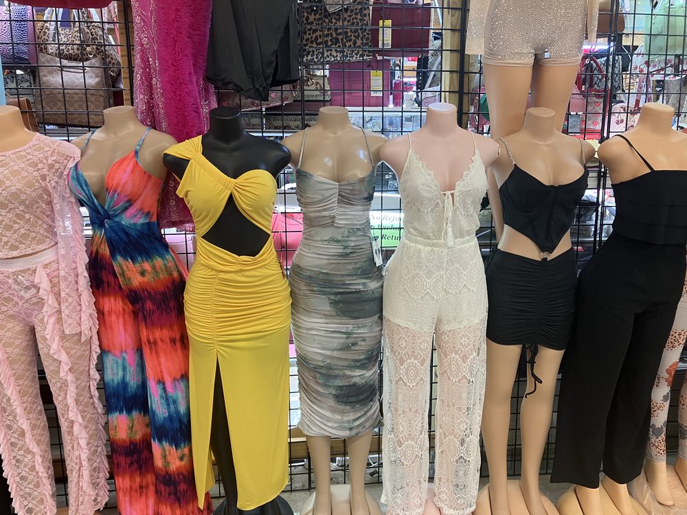 Colorful dresses and jumpsuits on mannequins